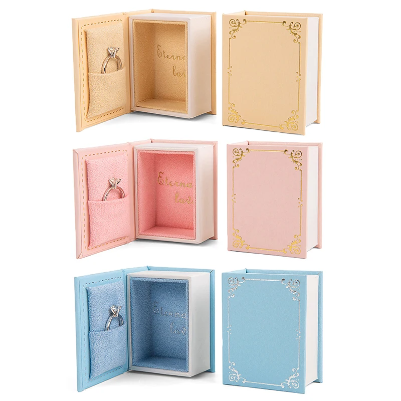NEW Book-shaped Ring Box With Suede Fabric Lining Creative Flip Lid Magnetic Ring Holder Earrings Jewelry Gift Case Accessorie
NEW Book-shaped Ring Box With Suede Fabric Lining Creative Flip Lid Magnetic Ring Holder Earrings Jewelry Gift Case Accessorie