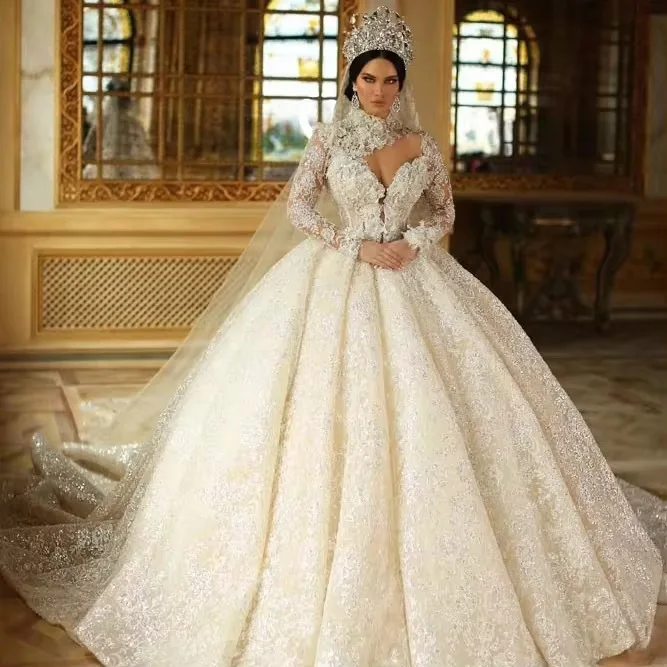 Luxury Sequin & Beaded Bridal Ball Gown Sheer High Neck Shiny Fabric Flower Applques Long Sleeves Royal Luxurious Wedding Dress
Luxury Sequin & Beaded Bridal Ball Gown Sheer High Neck Shiny Fabric Flower Applques Long Sleeves Royal Luxurious Wedding Dress