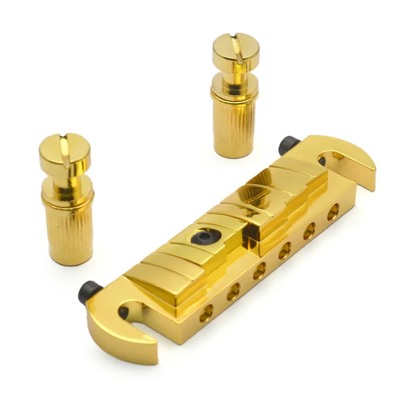 Vintage Electric Guitar Bridge One-Piece Tune-O-Matic Bridge 10.6mm String Spacing Stopbar Tailpiece For LP Guitar Parts
Vintage Electric Guitar Bridge One-Piece Tune-O-Matic Bridge 10.6mm String Spacing Stopbar Tailpiece For LP Guitar Parts