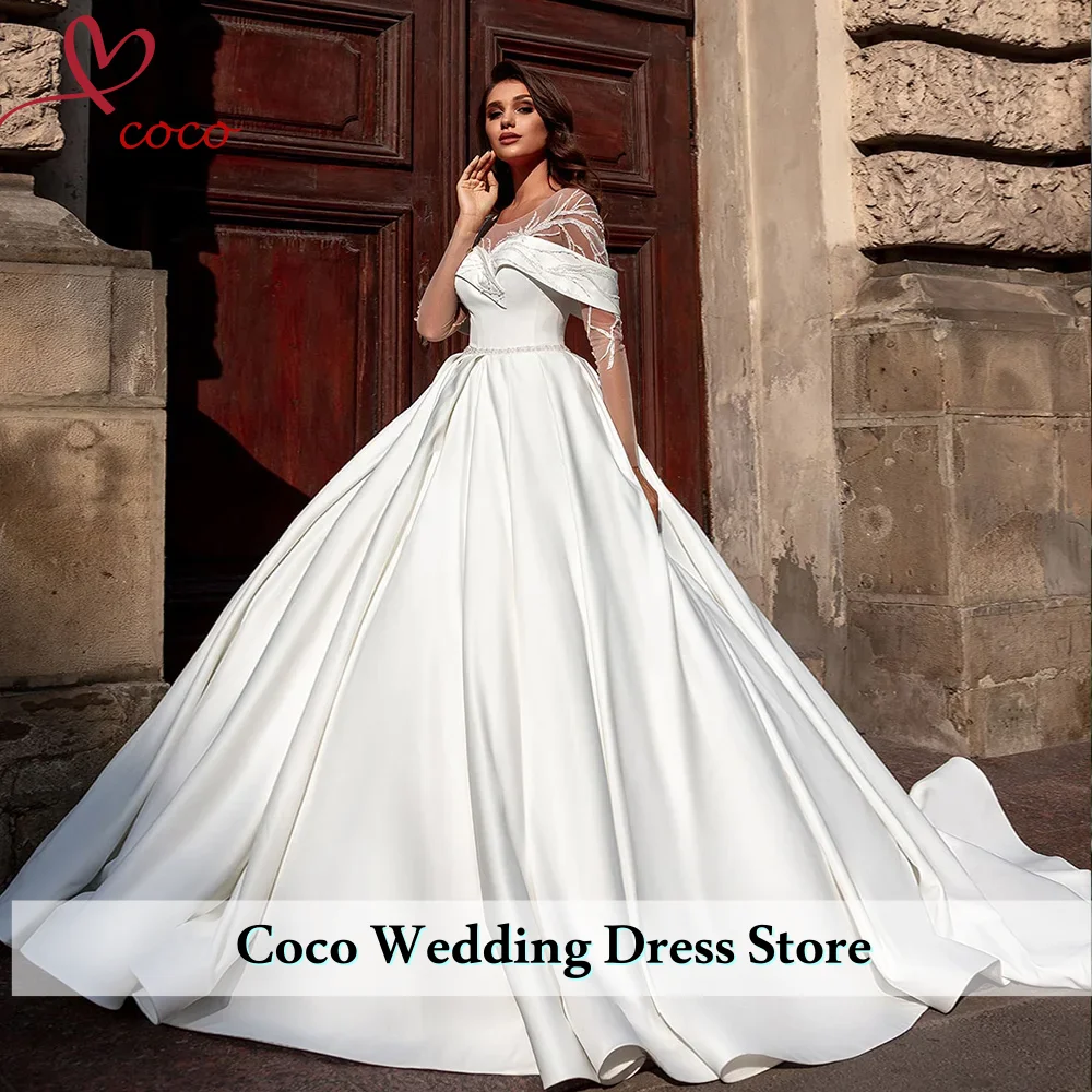 Индивидуальные элегантные роскошные атласные свадебные платья-балконеты Vestido De Noiva Princesa с пуговицами на спине и жемчугом, белые свадебные платья Mariage
Индивидуальные элегантные роскошные атласные свадебные платья-балконеты Vestido De Noiva Princesa с пуговицами на спине и жемчугом, белые свадебные платья Mariage