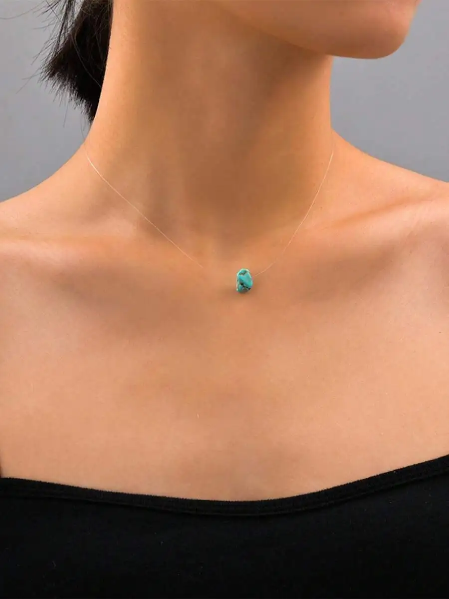 Turquoise pendant on invisible necklace for subtle elegance
Turquoise pendant on invisible necklace for subtle elegance