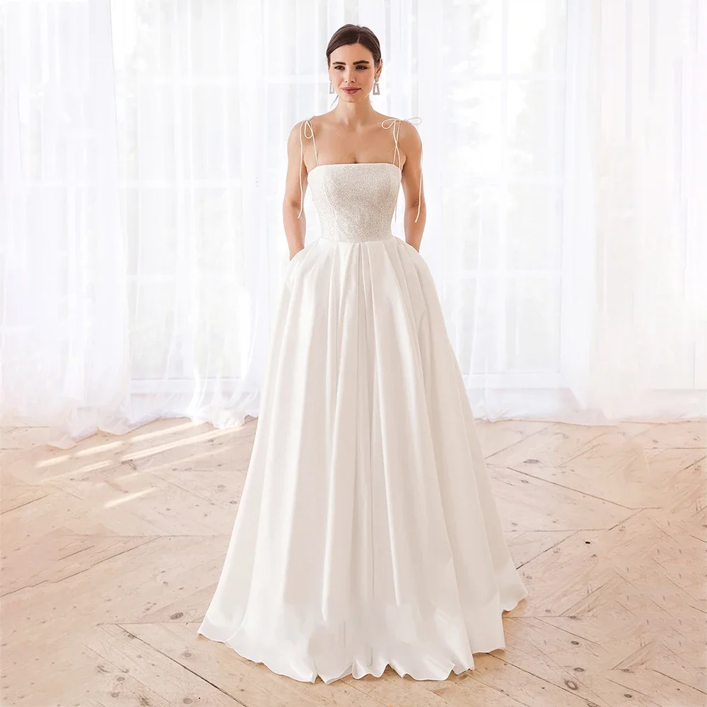 Customized Elegant Elegtant A-Line Wedding Dress Spaghetti Strap Sleeveless Lace Up Back Sweep Train Starpless Bride Gowns
Customized Elegant Elegtant A-Line Wedding Dress Spaghetti Strap Sleeveless Lace Up Back Sweep Train Starpless Bride Gowns
