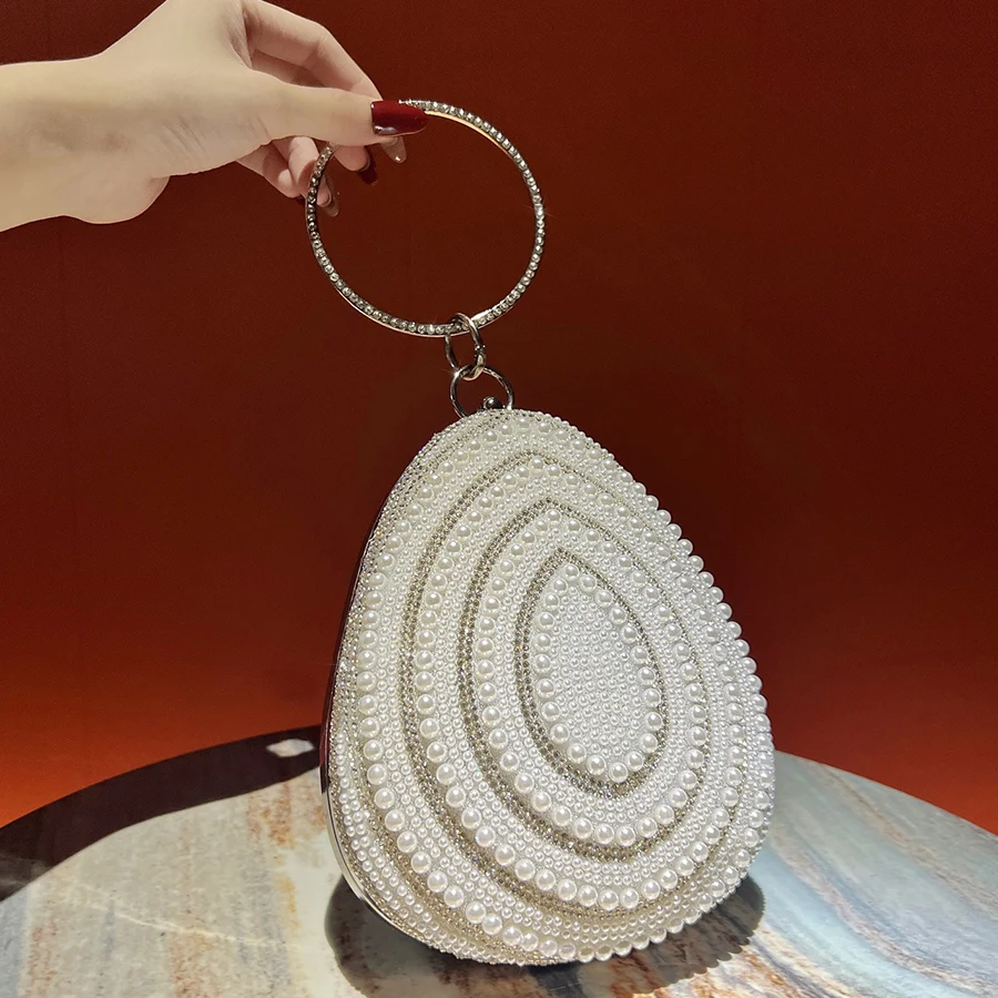 Irregular Oval Shape Clutch Purse Handbag Artificial Pearls Evening Bag Ring Handle For Women Wedding Party Chain Shoulder Bags
Irregular Oval Shape Clutch Purse Handbag Artificial Pearls Evening Bag Ring Handle For Women Wedding Party Chain Shoulder Bags