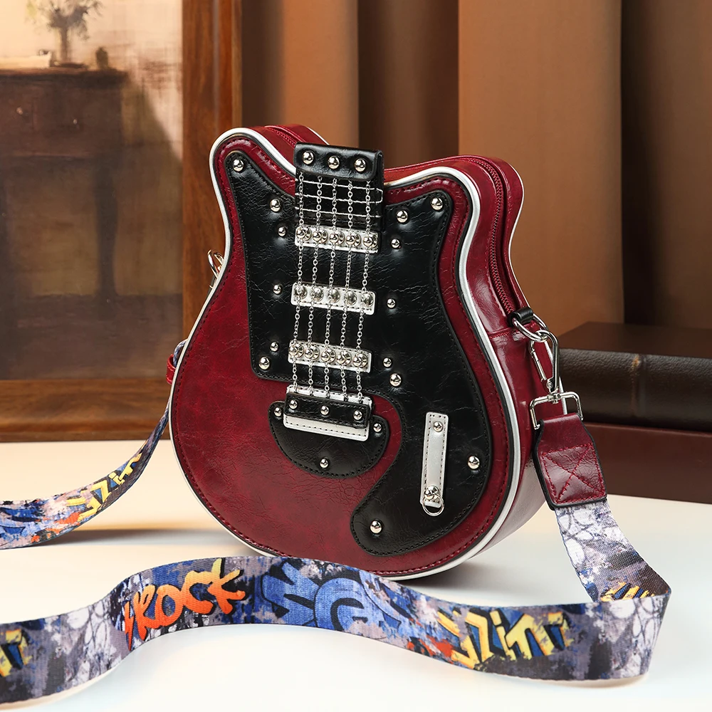 2026 New Creative Guitar Shaped Handbags for Women Rock & Roll Music Design Crossbody Bag Funny Punk Studded Shoulder Purse
2026 New Creative Guitar Shaped Handbags for Women Rock & Roll Music Design Crossbody Bag Funny Punk Studded Shoulder Purse
