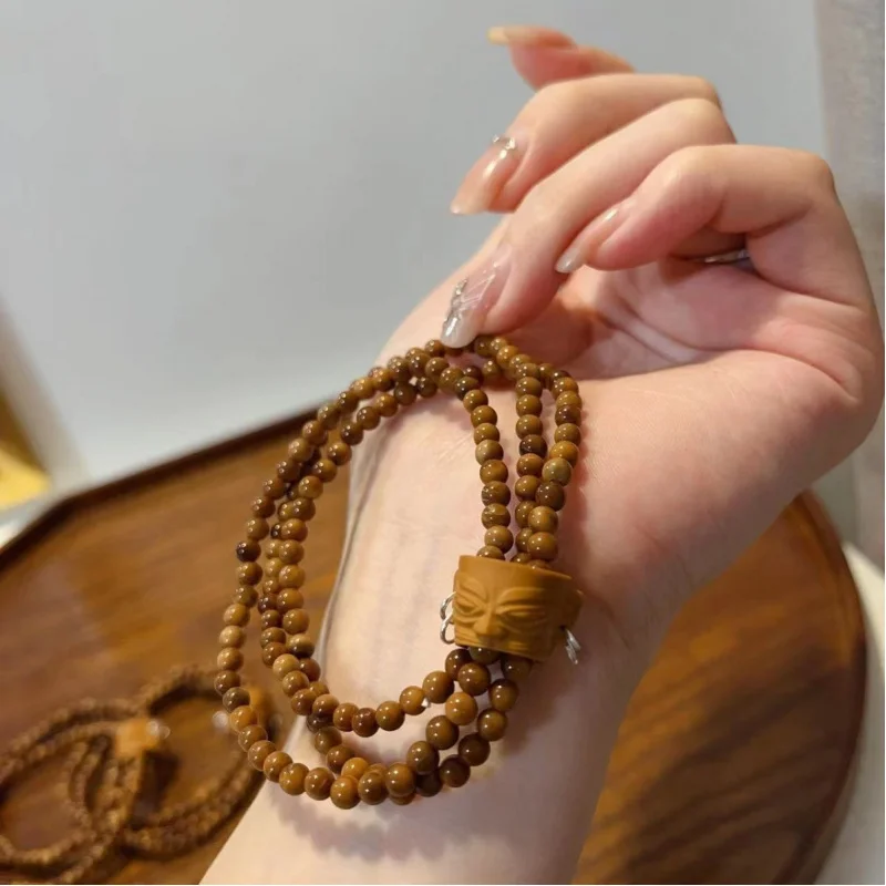 Multi-loop bracelet with olive beads and Sanxingdui running rings, hand-woven jewelry accessory
Multi-loop bracelet with olive beads and Sanxingdui running rings, hand-woven jewelry accessory