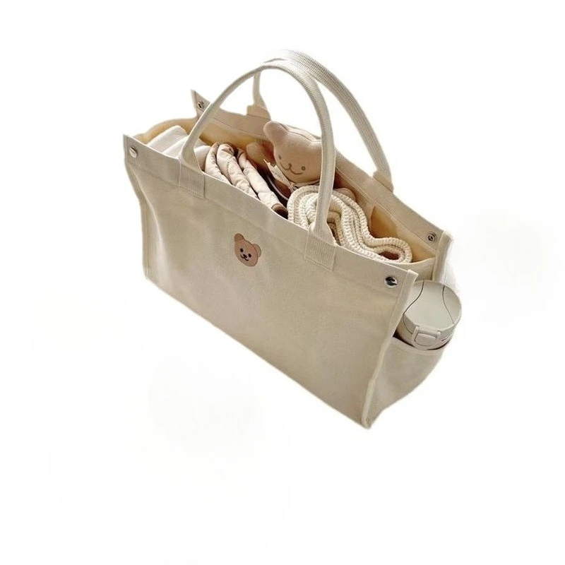 Korean ins style mommy bag embroidered bear canvas tote bag, handbag going out fashionable large-capacity women's bag
Korean ins style mommy bag embroidered bear canvas tote bag, handbag going out fashionable large-capacity women's bag