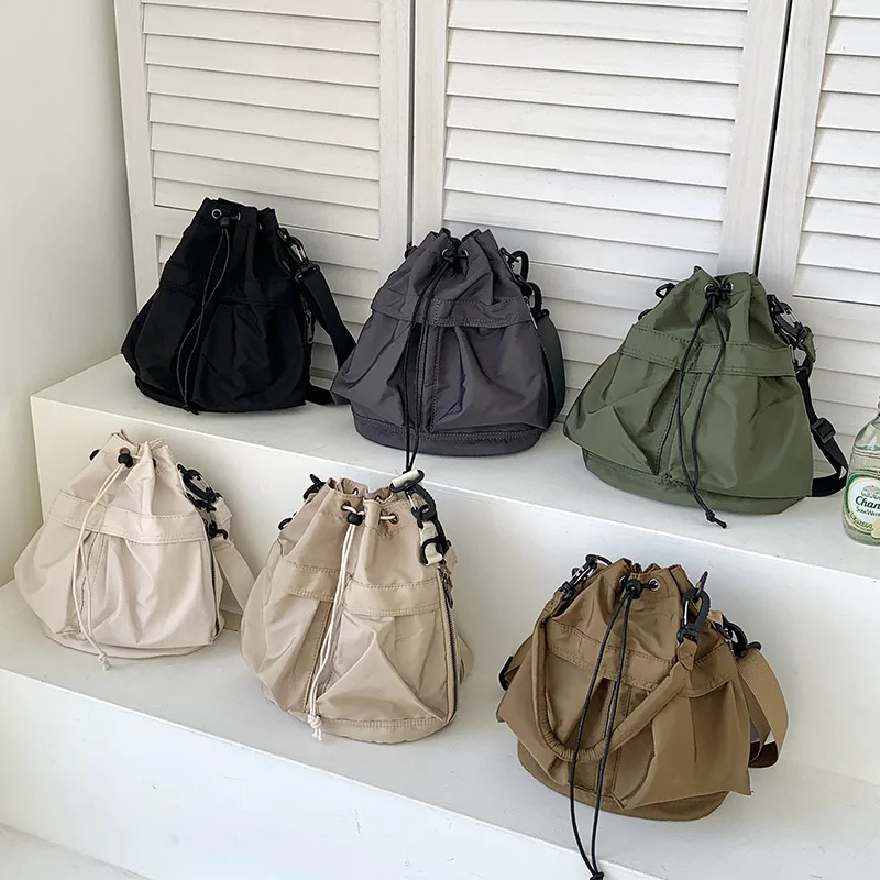 Summer Large Capacity Drawstring Nylon Women's Bucket Bags Fashionable Casual Handbag Versatile Commuting Shoulder Crossbody Bag
Summer Large Capacity Drawstring Nylon Women's Bucket Bags Fashionable Casual Handbag Versatile Commuting Shoulder Crossbody Bag