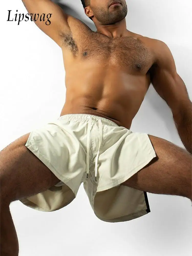 Сексуальные шорты на молнии с боковым разрезом, мужские спортивные шорты для фитнеса, тонкие быстросохнущие шорты из ледяного шелка на шнуровке, летние повседневные мужские однотонные шорты
Сексуальные шорты на молнии с боковым разрезом, мужские спортивные шорты для фитнеса, тонкие быстросохнущие шорты из ледяного шелка на шнуровке, летние повседневные мужские однотонные шорты