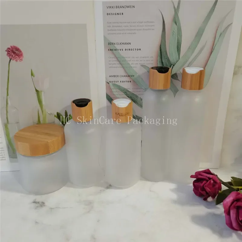 frosted plastic bottle with bamboo disc cap and plastic cream jar empty health cosmetic containers with bamboo wooden caps
frosted plastic bottle with bamboo disc cap and plastic cream jar empty health cosmetic containers with bamboo wooden caps