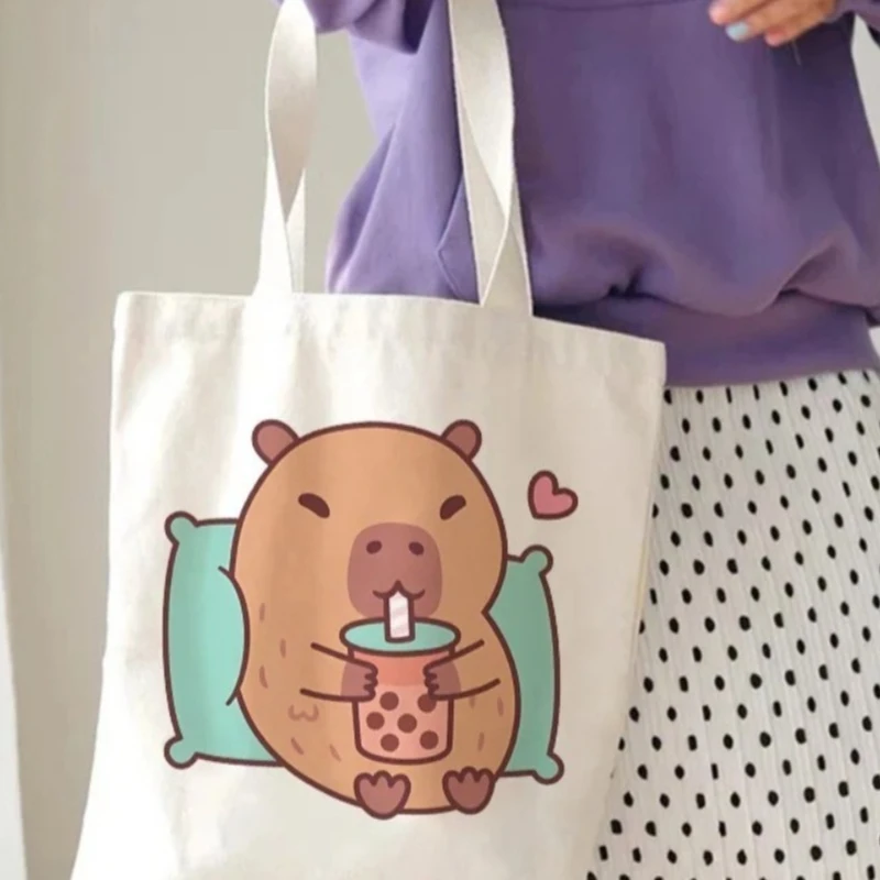 2026 Women Men Canvas Tote Bag Cute Capybara Drinking Print Casual Reusable Shoulder Bag for Daily Grocery & Kawaii Streetwear
2026 Women Men Canvas Tote Bag Cute Capybara Drinking Print Casual Reusable Shoulder Bag for Daily Grocery & Kawaii Streetwear