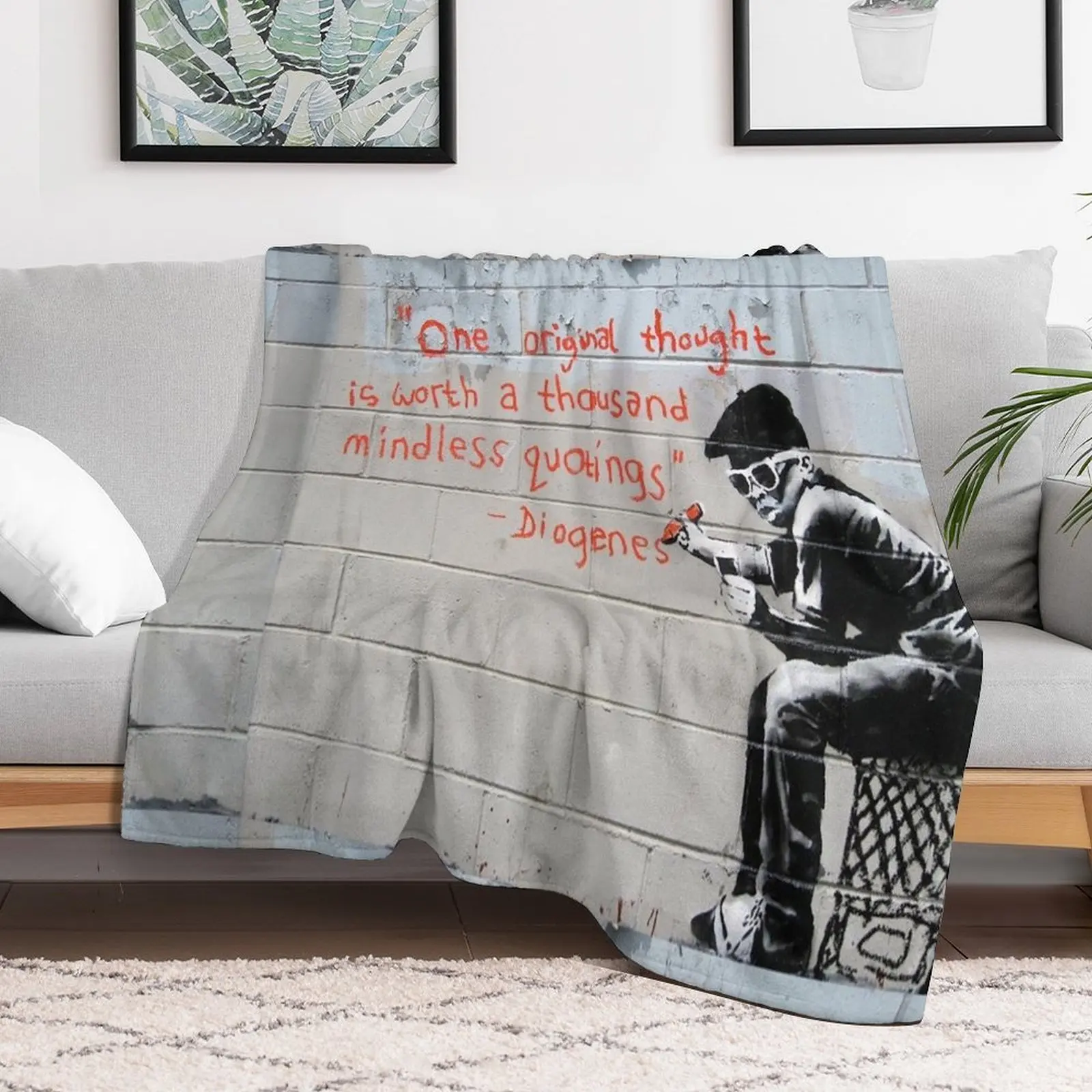 Banksy street graffiti art One original thought is worth a thousand mindless quotings Diogenes Throw Blanket
Banksy street graffiti art One original thought is worth a thousand mindless quotings Diogenes Throw Blanket
