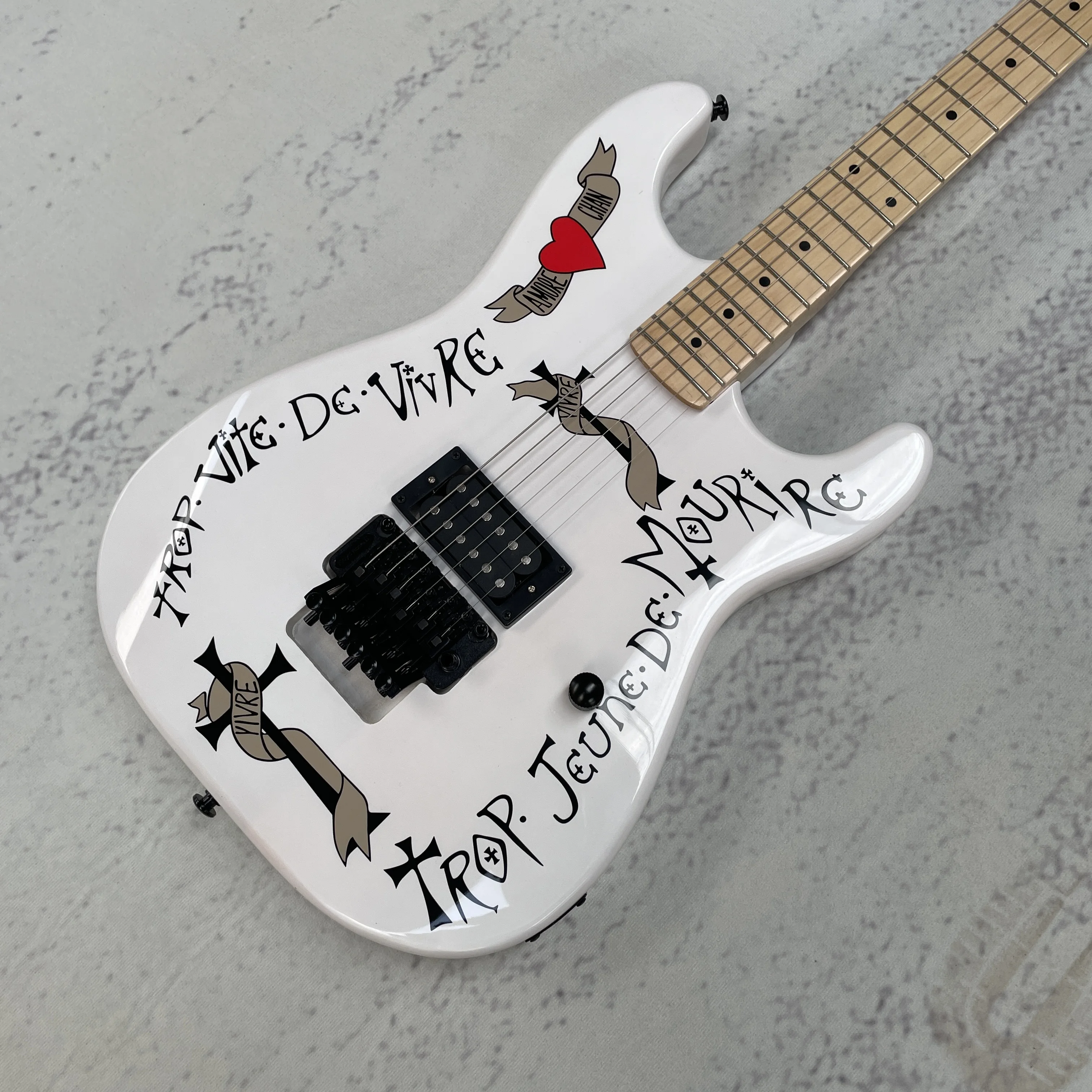 White six-string, H pickup, vibrato system, maple neck