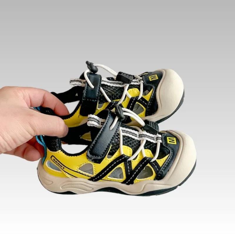 Children's Anti Kick Sandals 2026 New Summer Girls' Fashion Breathable Casual Shoes Hollow Soft Bottom Boys' Sports Sandals
Children's Anti Kick Sandals 2026 New Summer Girls' Fashion Breathable Casual Shoes Hollow Soft Bottom Boys' Sports Sandals