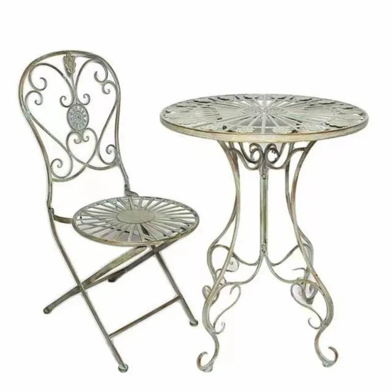 Vintage pastoral green French garden table and chairs
Vintage pastoral green French garden table and chairs