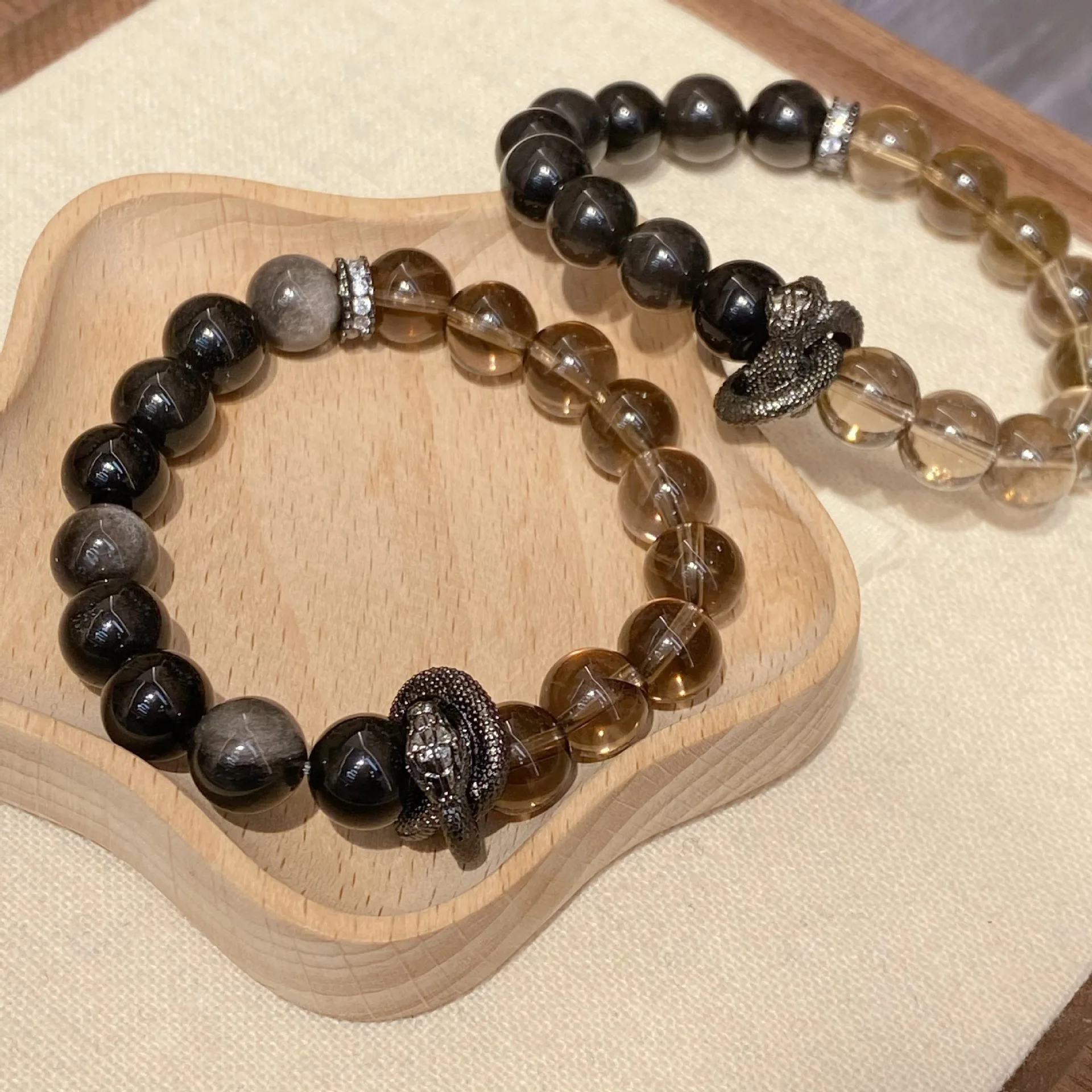 Snake Year New Tea Crystal Fashion Natural Dark Handstring Obsidian Lucky Hand String
Snake Year New Tea Crystal Fashion Natural Dark Handstring Obsidian Lucky Hand String