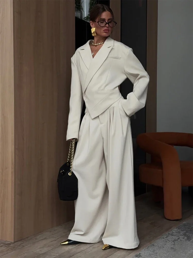 Elegant Solid Irregular Blazer Set Lady Fashion Lapel Single Button Loose Jacket Wide-leg Pants Sets 2026 New Commute Outfit
Elegant Solid Irregular Blazer Set Lady Fashion Lapel Single Button Loose Jacket Wide-leg Pants Sets 2026 New Commute Outfit