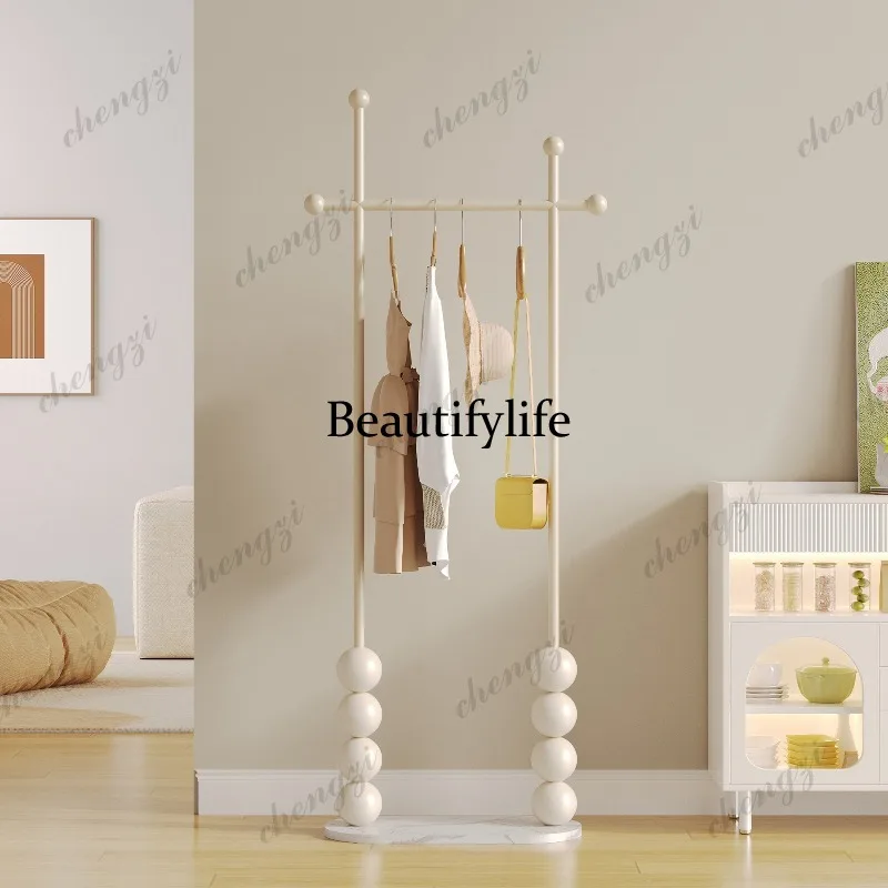 Bedroom floor hanger household cream wind coat rack corner storage rack bedside
Bedroom floor hanger household cream wind coat rack corner storage rack bedside