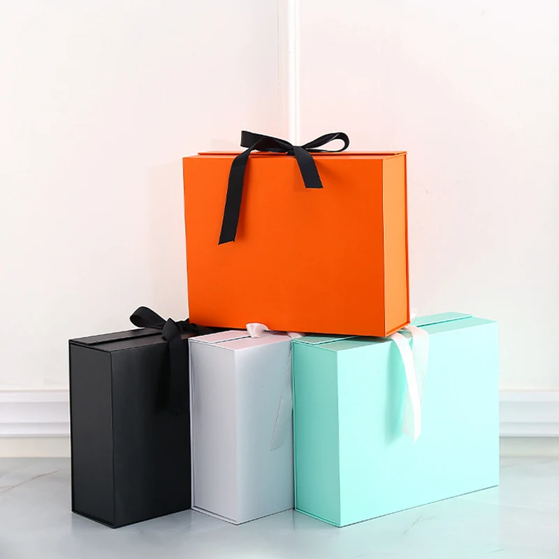 Gift Box With Silk Bowknot For Wedding Birthday Party Festival Magnet Clamshell Paper Box Custom Logo Product Packaging Box
Gift Box With Silk Bowknot For Wedding Birthday Party Festival Magnet Clamshell Paper Box Custom Logo Product Packaging Box