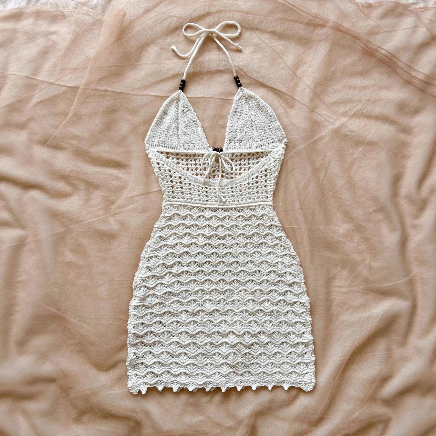 New Summer Women's Sexy and Fashionable Solid Color V-neck Knitted Hollow Hanging Neck Backless Beach Skirt
New Summer Women's Sexy and Fashionable Solid Color V-neck Knitted Hollow Hanging Neck Backless Beach Skirt