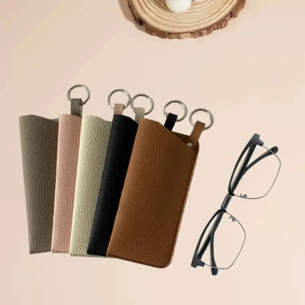 PU Leather Sunglasses Storage Bag with Keyring Durable Hanging Sunglasses Portable Solid Color SunGlasses Holder
PU Leather Sunglasses Storage Bag with Keyring Durable Hanging Sunglasses Portable Solid Color SunGlasses Holder