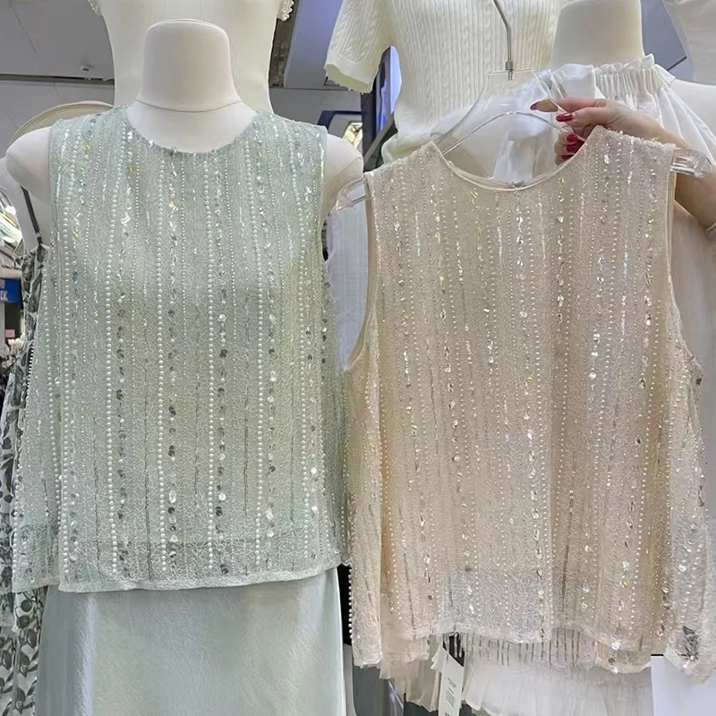 Design sense Heavy industry nail bead sequin tassel vest women's summer new fashion loose fitting sleeveless vest
Design sense Heavy industry nail bead sequin tassel vest women's summer new fashion loose fitting sleeveless vest
