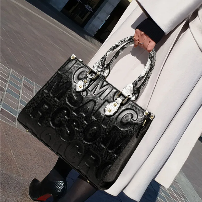 Aidrani Women's Large-Capacity Black Genuine Leather Handbag, Letter Embossed One-Shoulder Tote Bag, High-End Mom Bag
Aidrani Women's Large-Capacity Black Genuine Leather Handbag, Letter Embossed One-Shoulder Tote Bag, High-End Mom Bag
