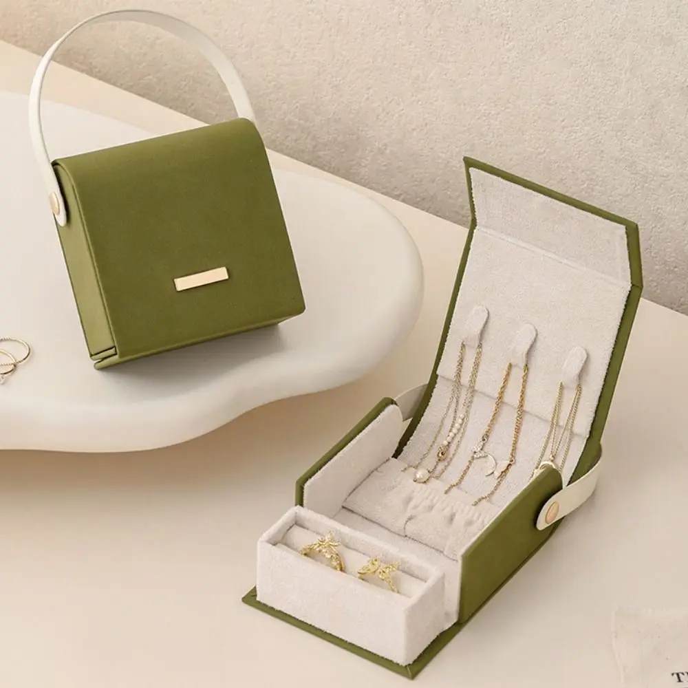 Hand-Held Jewelry Packing Bag Handbag Appearance Rings Necklace Earrings Storage Case Organizer PU Leather Jewelry Display Box
Hand-Held Jewelry Packing Bag Handbag Appearance Rings Necklace Earrings Storage Case Organizer PU Leather Jewelry Display Box