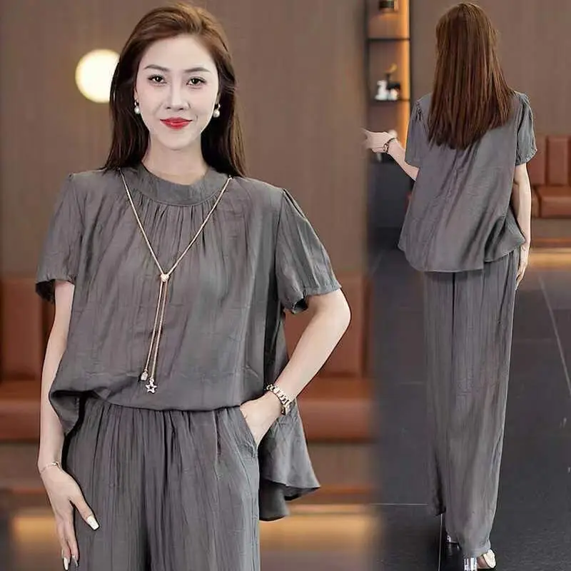 Summer 2026 Loose Design Slimming Short Sleeve Top Wide Leg Pants Two Piece Set Elegant Quality Women's Casual Sportswear
Summer 2026 Loose Design Slimming Short Sleeve Top Wide Leg Pants Two Piece Set Elegant Quality Women's Casual Sportswear
