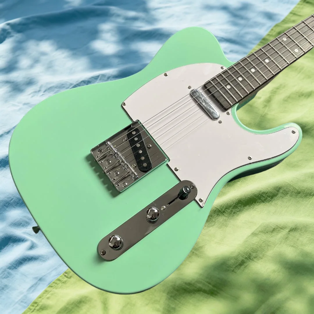 Green TLE Alder Body Maple Fingerboard Free Shipping Electric Guitar Gift
Green TLE Alder Body Maple Fingerboard Free Shipping Electric Guitar Gift