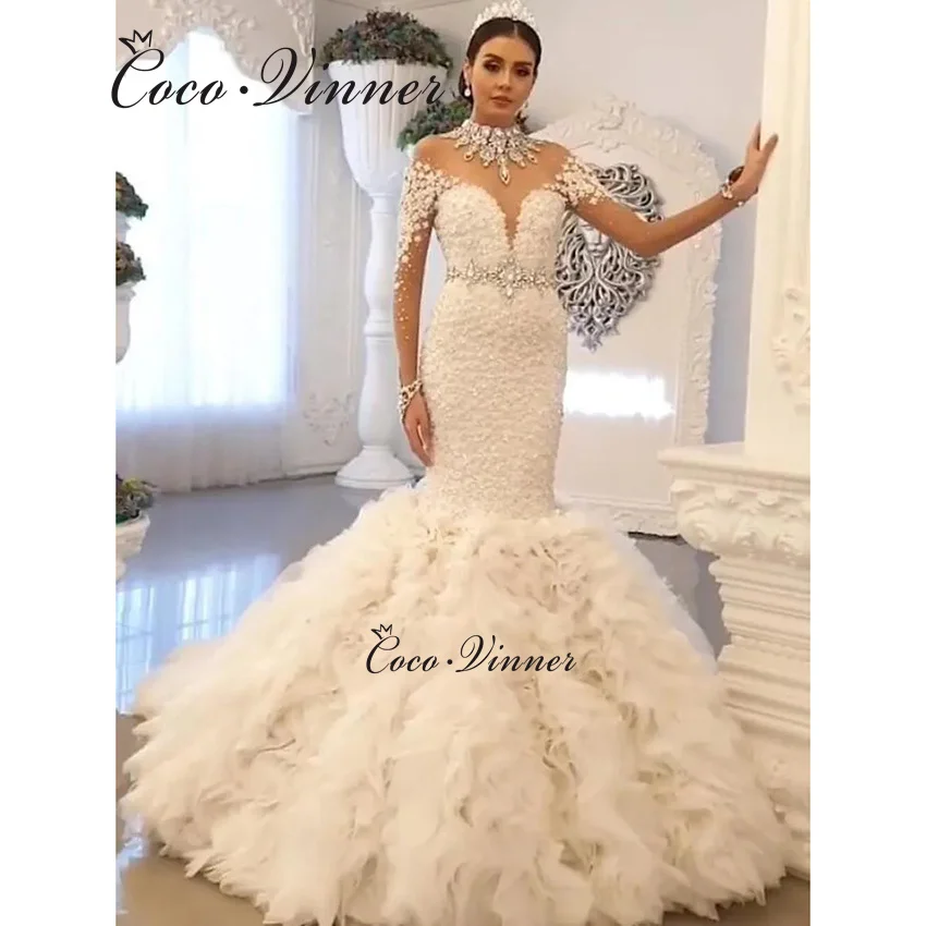 Свадебное платье русалки с высоким воротом и складками из тюля и оборками, Южная Африка, 2026, качественные свадебные платья с кристаллами и бисером W1455
Свадебное платье русалки с высоким воротом и складками из тюля и оборками, Южная Африка, 2026, качественные свадебные платья с кристаллами и бисером W1455