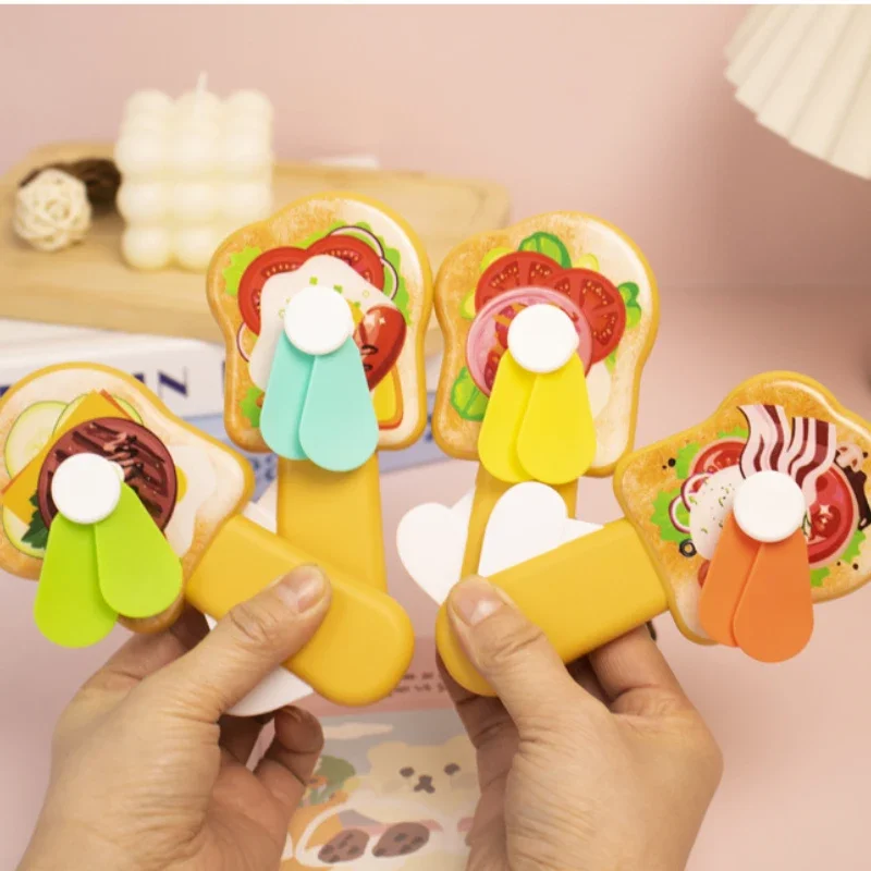 Hot Selling Mini Hand Fan Cute Bread Toast Summer Hand Fan Cartoon Hand Pressure Fan Gift for Girlfriend
Hot Selling Mini Hand Fan Cute Bread Toast Summer Hand Fan Cartoon Hand Pressure Fan Gift for Girlfriend
