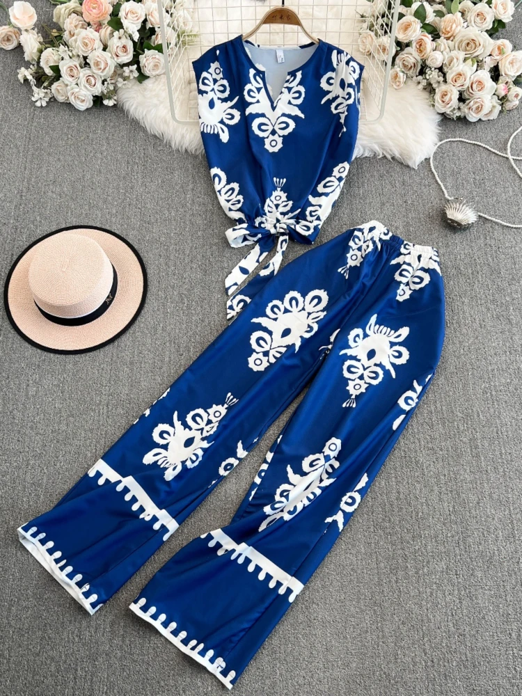 2025 Summer New Irregular Printed Sleeveless V-neck Laca-up Top High Waist Wide Leg Pants Women's Casual Two Piece Set
2025 Summer New Irregular Printed Sleeveless V-neck Laca-up Top High Waist Wide Leg Pants Women's Casual Two Piece Set