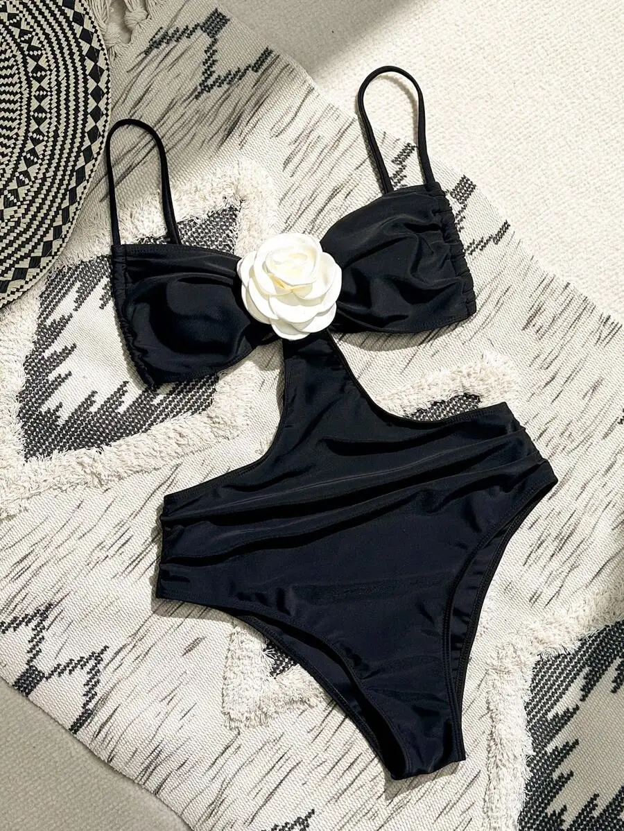 Black One-Piece Swimsuit With 3D White Flower Decoration And Hollow Out Detail
Black One-Piece Swimsuit With 3D White Flower Decoration And Hollow Out Detail