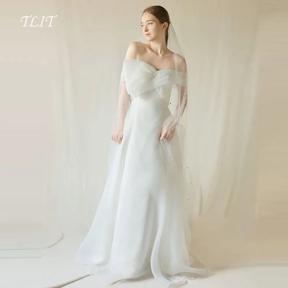 TLIT Элегантные свадебные платья трапециевидной формы из органзы цвета слоновой кости, корейское свадебное платье, свадебные платья без бретелек с открытыми плечами по индивидуальному заказу
TLIT Элегантные свадебные платья трапециевидной формы из органзы цвета слоновой кости, корейское свадебное платье, свадебные платья без бретелек с открытыми плечами по индивидуальному заказу