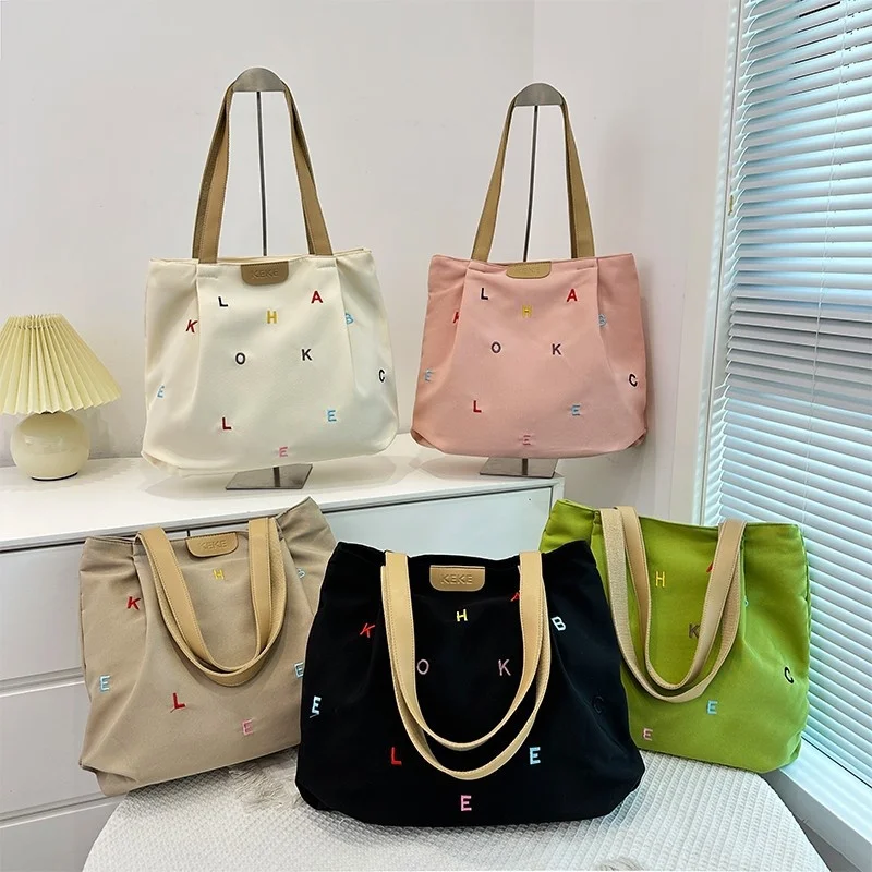 2025 New Embroidered Letters Canvas Tote Bag Women's Trendy Shoulder Purse for School and Shopping
2025 New Embroidered Letters Canvas Tote Bag Women's Trendy Shoulder Purse for School and Shopping