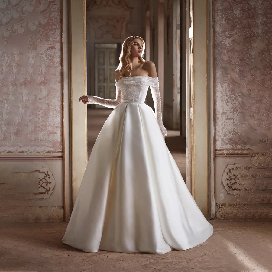 Customized Shimmering Sequin Wedding Dress Off-the-Shoulder Long Sleeves Shiny Satin Bridal Gown Features Pockets Sweep Train
Customized Shimmering Sequin Wedding Dress Off-the-Shoulder Long Sleeves Shiny Satin Bridal Gown Features Pockets Sweep Train