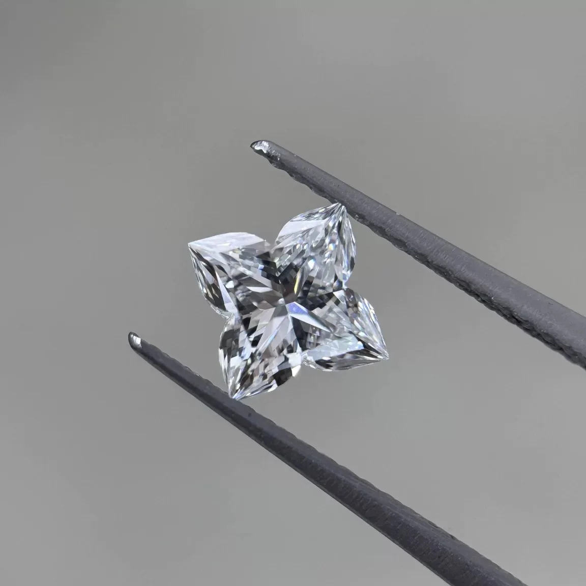 Genuine Moissanite raw stone, D/DEF color, custom-set with a four-leaf clover.
Genuine Moissanite raw stone, D/DEF color, custom-set with a four-leaf clover.