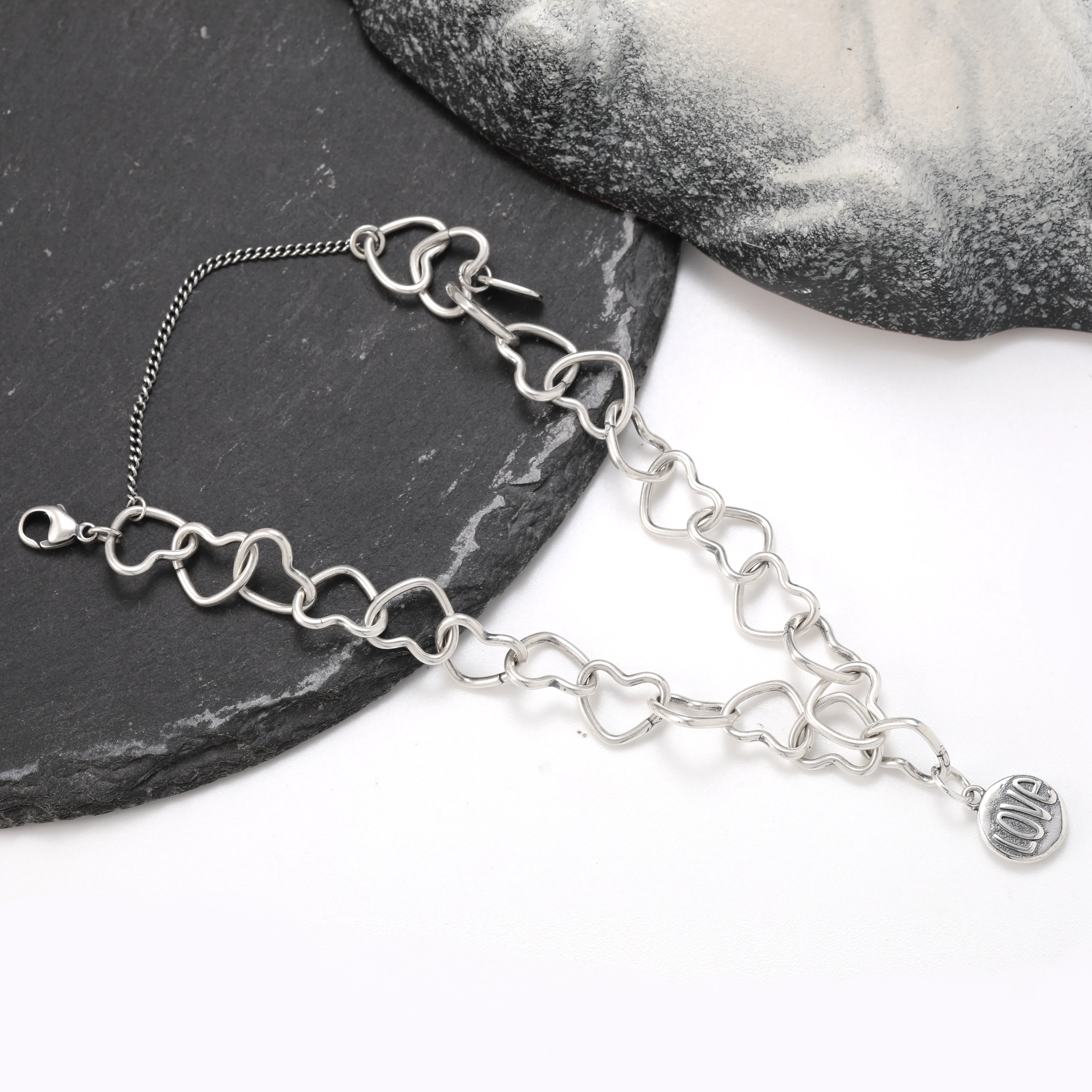 Genuine 925 sterling silver Connected Hearts Charm Bracelet paired with a love pendant
Genuine 925 sterling silver Connected Hearts Charm Bracelet paired with a love pendant