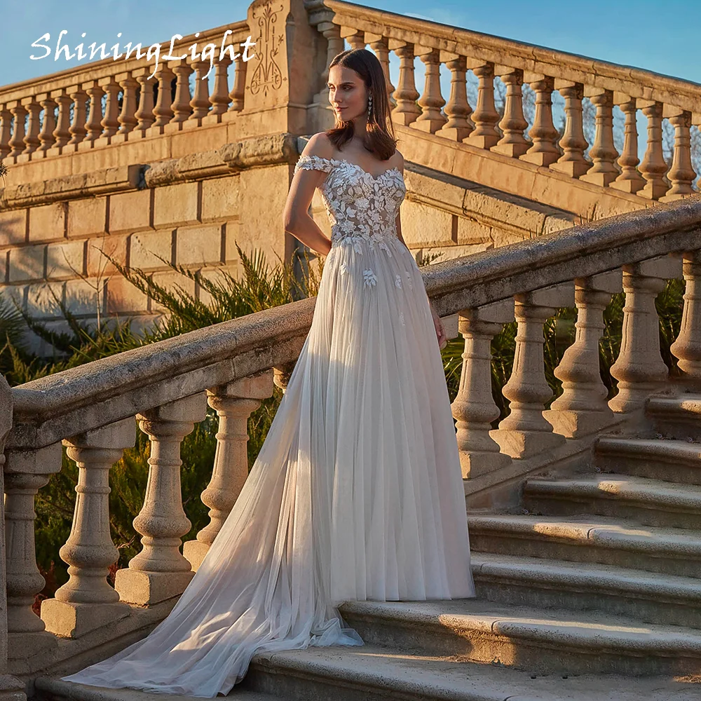 ShiningLight Boho Wedding Dress 2026 V Neck Off-Shoulder Applique Soft Tulle A Line Bridal Gown novia boho chic Customized
ShiningLight Boho Wedding Dress 2026 V Neck Off-Shoulder Applique Soft Tulle A Line Bridal Gown novia boho chic Customized