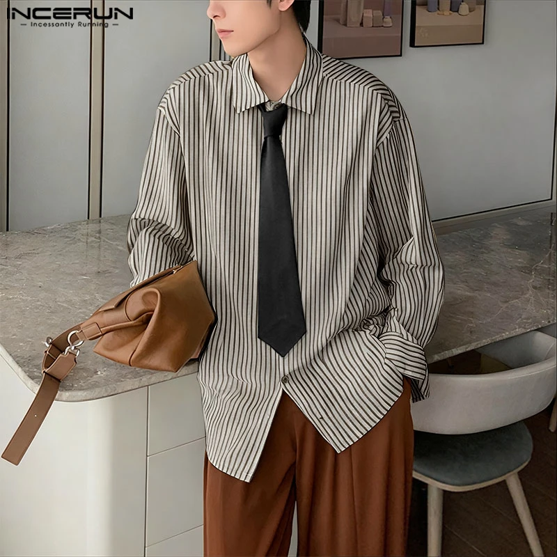 INCERUN Мужская полосатая рубашка с лацканами и длинным рукавом в корейском стиле Мужская одежда с галстуком Уличная одежда Свободные модные повседневные топы Мужские рубашки 
INCERUN Мужская полосатая рубашка с лацканами и длинным рукавом в корейском стиле Мужская одежда с галстуком Уличная одежда Свободные модные повседневные топы Мужские рубашки