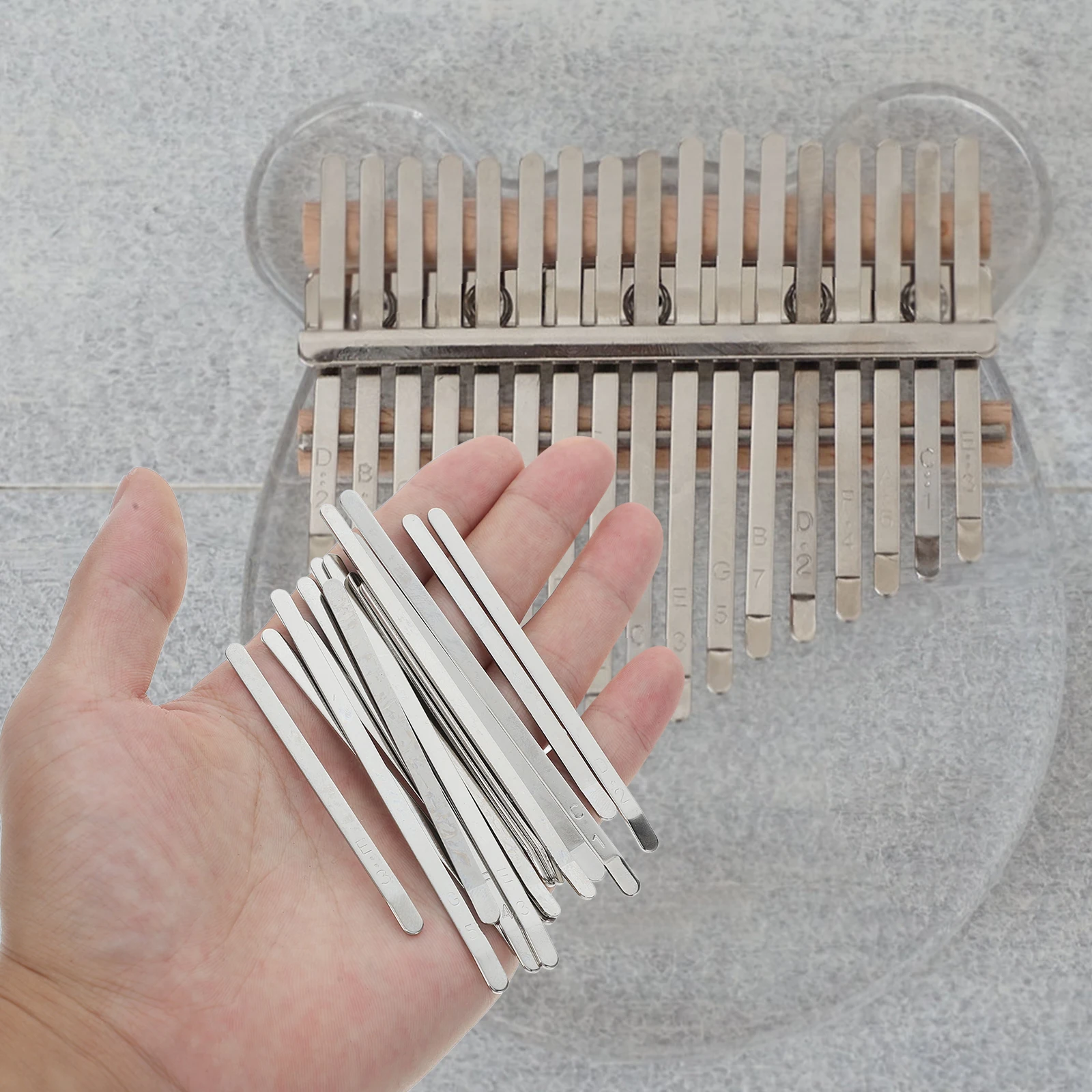 1 Set Of 17 Note Kalimba Keys Thumb Piano Replacement Parts Flexible Metal Strips Smooth Bending Design High-Quality Accessories
1 Set Of 17 Note Kalimba Keys Thumb Piano Replacement Parts Flexible Metal Strips Smooth Bending Design High-Quality Accessories