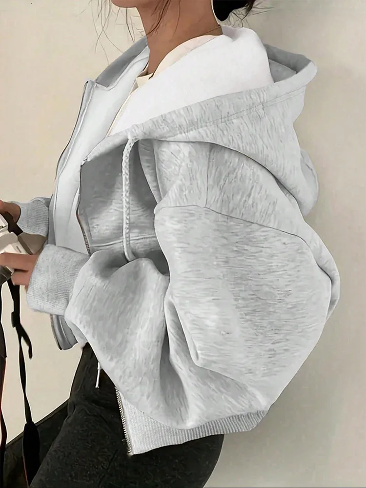 Spring simple temperament drawstring hooded design sense of loose long-sleeved hoodie cardigan coat
Spring simple temperament drawstring hooded design sense of loose long-sleeved hoodie cardigan coat