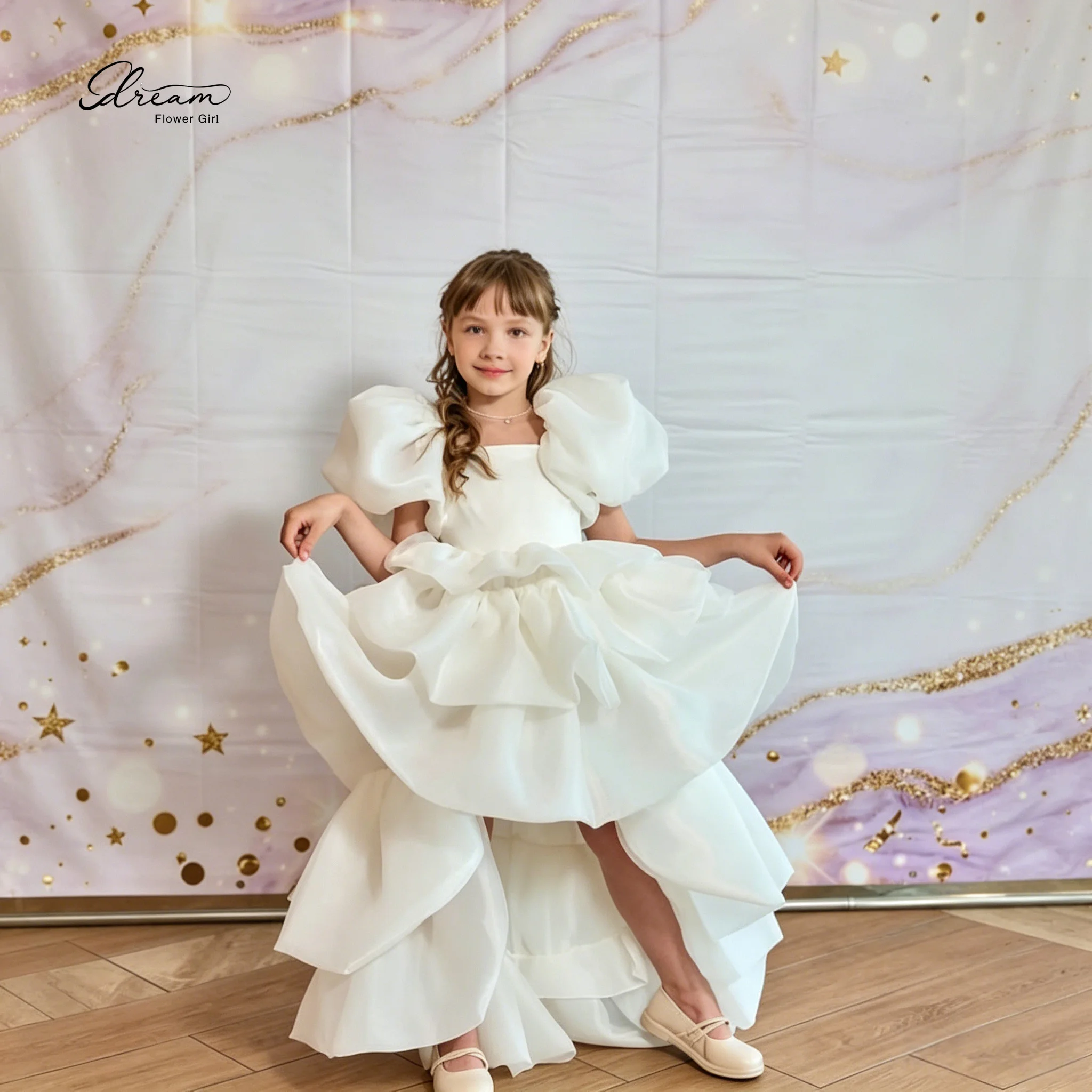 Exquisite white formal dress for girls featuring a princess style puff sleeves a cape design and an asymmetrical lace hem
Exquisite white formal dress for girls featuring a princess style puff sleeves a cape design and an asymmetrical lace hem