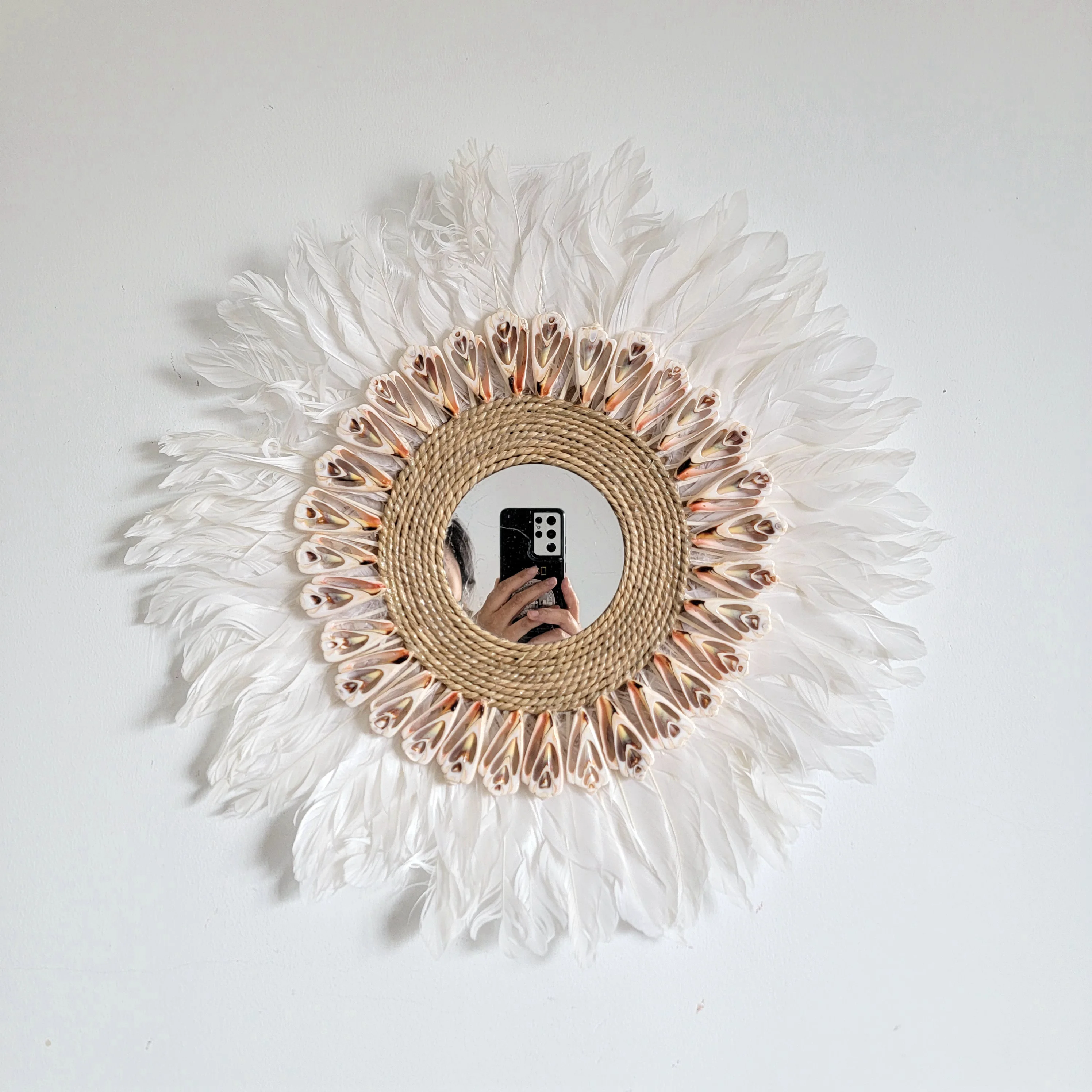 Feather & Rattan Wall Mirror: A Dreamy Bohemian Accent Handcrafted feather and shell mirror
Feather & Rattan Wall Mirror: A Dreamy Bohemian Accent Handcrafted feather and shell mirror