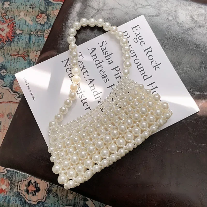 2024 New Handwoven Women's Handbag Fashion Retro Pearl Dinner Beaded Bag High Quality Versatile Mobile Phone Shoulder Bags
2024 New Handwoven Women's Handbag Fashion Retro Pearl Dinner Beaded Bag High Quality Versatile Mobile Phone Shoulder Bags