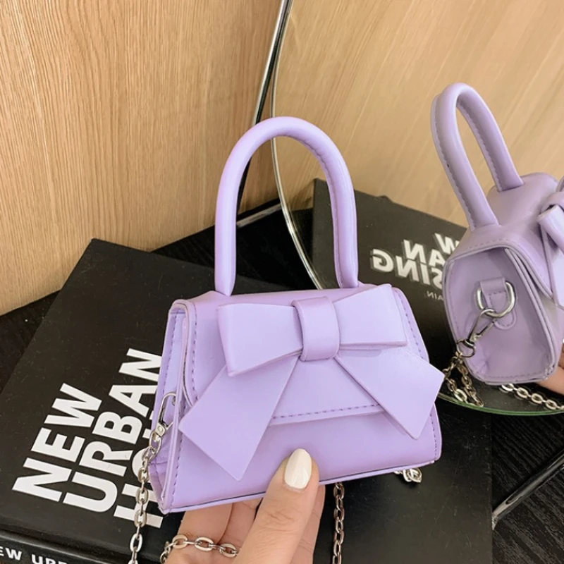 Маленькие квадратные сумки на плечо с милым бантом для девочек, универсальная детская сумка через плечо с цепочкой, однотонные детские сумки из искусственной кожи, кошелек для монет
Маленькие квадратные сумки на плечо с милым бантом для девочек, универсальная детская сумка через плечо с цепочкой, однотонные детские сумки из искусственной кожи, кошелек для монет