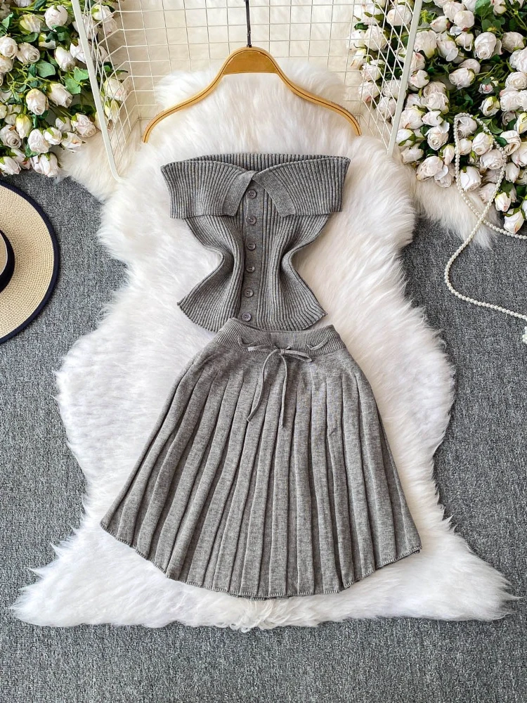 Сексуальный однобортный жилет без бретелек с манжетами, короткий стильный вязаный топ с высокой талией, утягивающая плиссированная короткая юбка, однотонный комплект
Сексуальный однобортный жилет без бретелек с манжетами, короткий стильный вязаный топ с высокой талией, утягивающая плиссированная короткая юбка, однотонный комплект