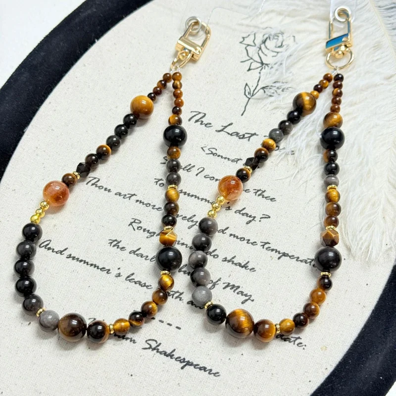 Natural yellow tiger eye, silver obsidian, yellow Tacca crystal, handmade beaded phone charm, keychain bag decorative accessory
Natural yellow tiger eye, silver obsidian, yellow Tacca crystal, handmade beaded phone charm, keychain bag decorative accessory