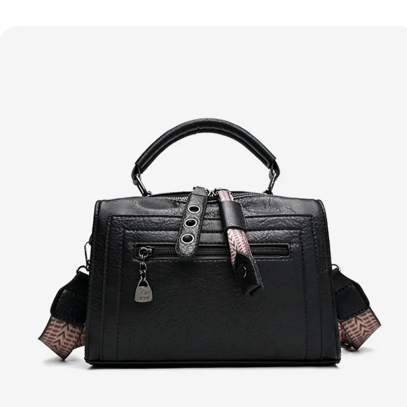 Structured Boston-style handbag with top handle & wide strap, multi-way carry design for everyday use
Structured Boston-style handbag with top handle & wide strap, multi-way carry design for everyday use