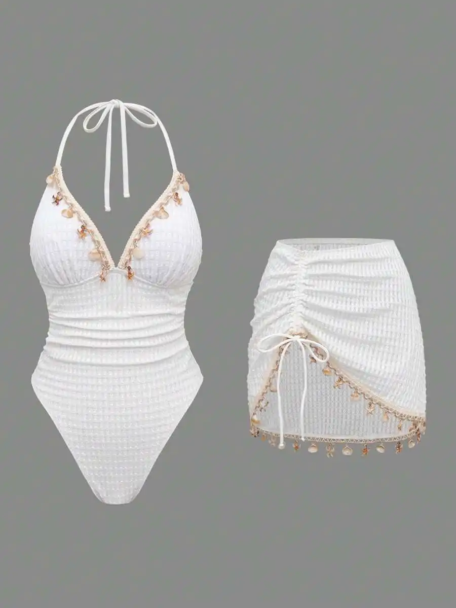 White Waffle-Knit Halter One-Piece Swimsuit With Shell Trim And Side Tie Skirt Cover-Up
White Waffle-Knit Halter One-Piece Swimsuit With Shell Trim And Side Tie Skirt Cover-Up